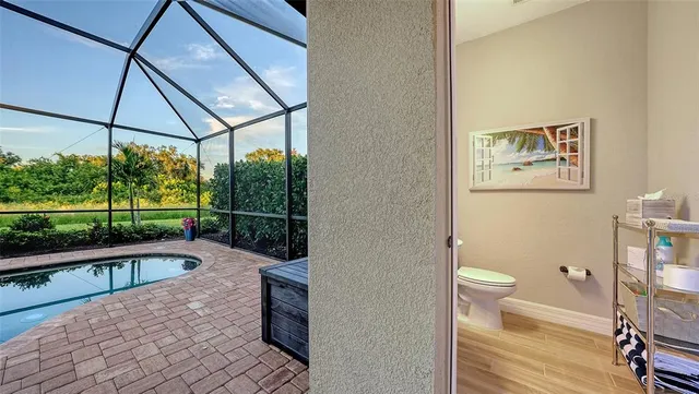 a view of a swimming pool with a porch