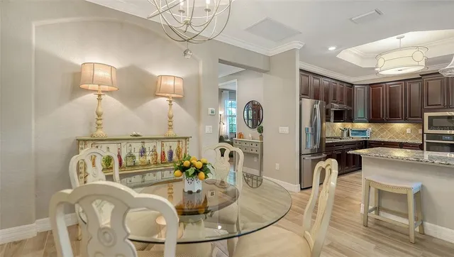 a view of a livingroom with furniture flat screen tv and wooden floor
