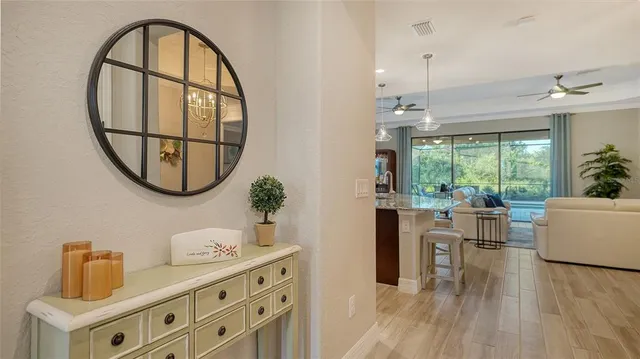 a bed room with furniture and a flat screen tv