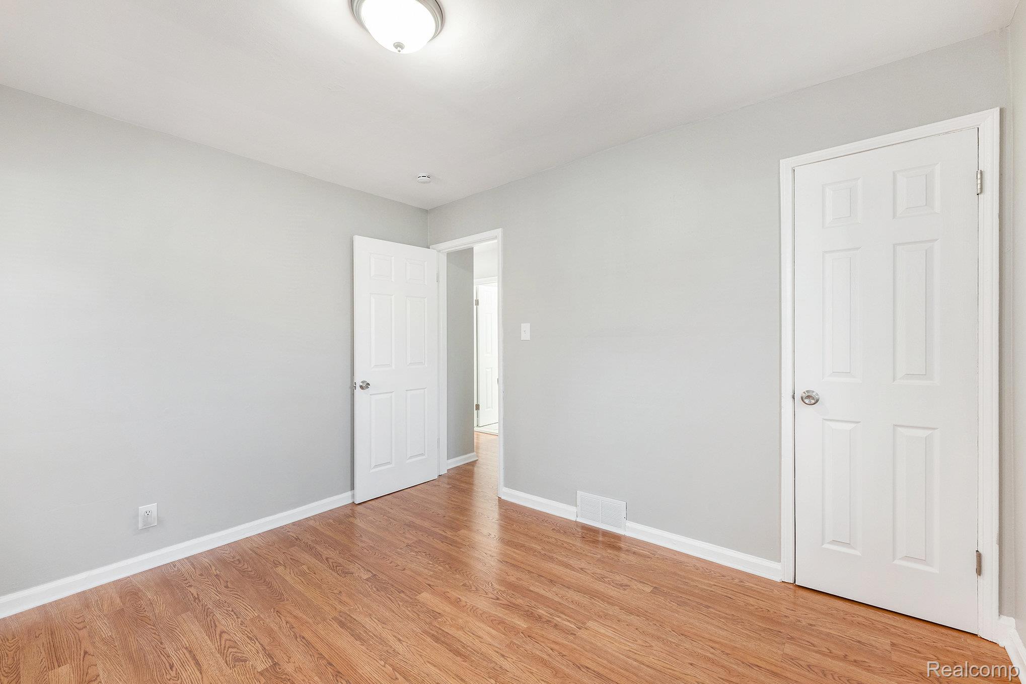 19315 Annchester Road Detroit, MI 48219 - Photo 8 of 17 Empty room featuring light wood finished floors and baseboards
