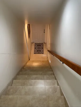 a view of a hallway with staircase