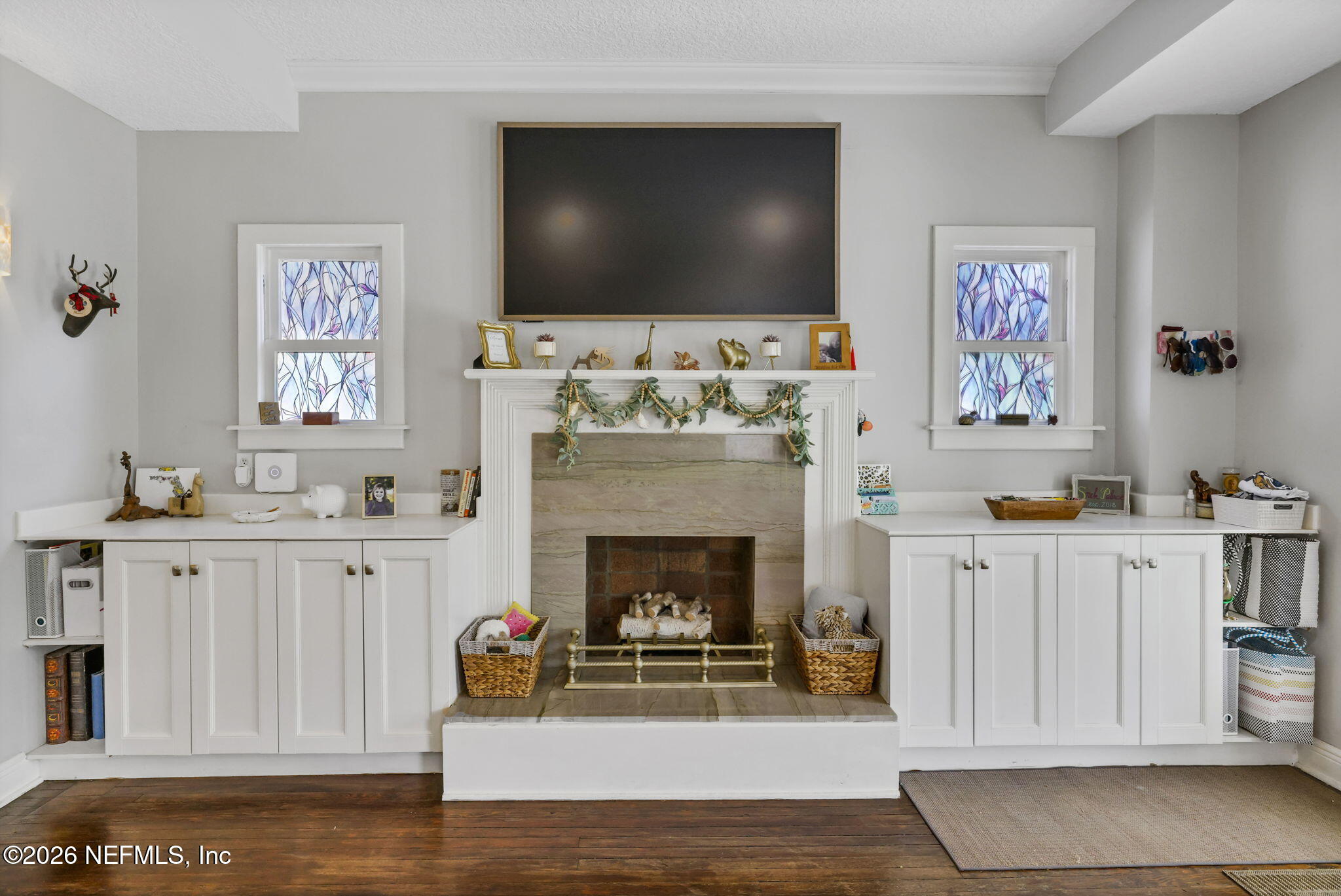 2837 Post Street Jacksonville, FL 32205 - Photo 15 of 70 a living room with furniture a flat screen tv and a fireplace