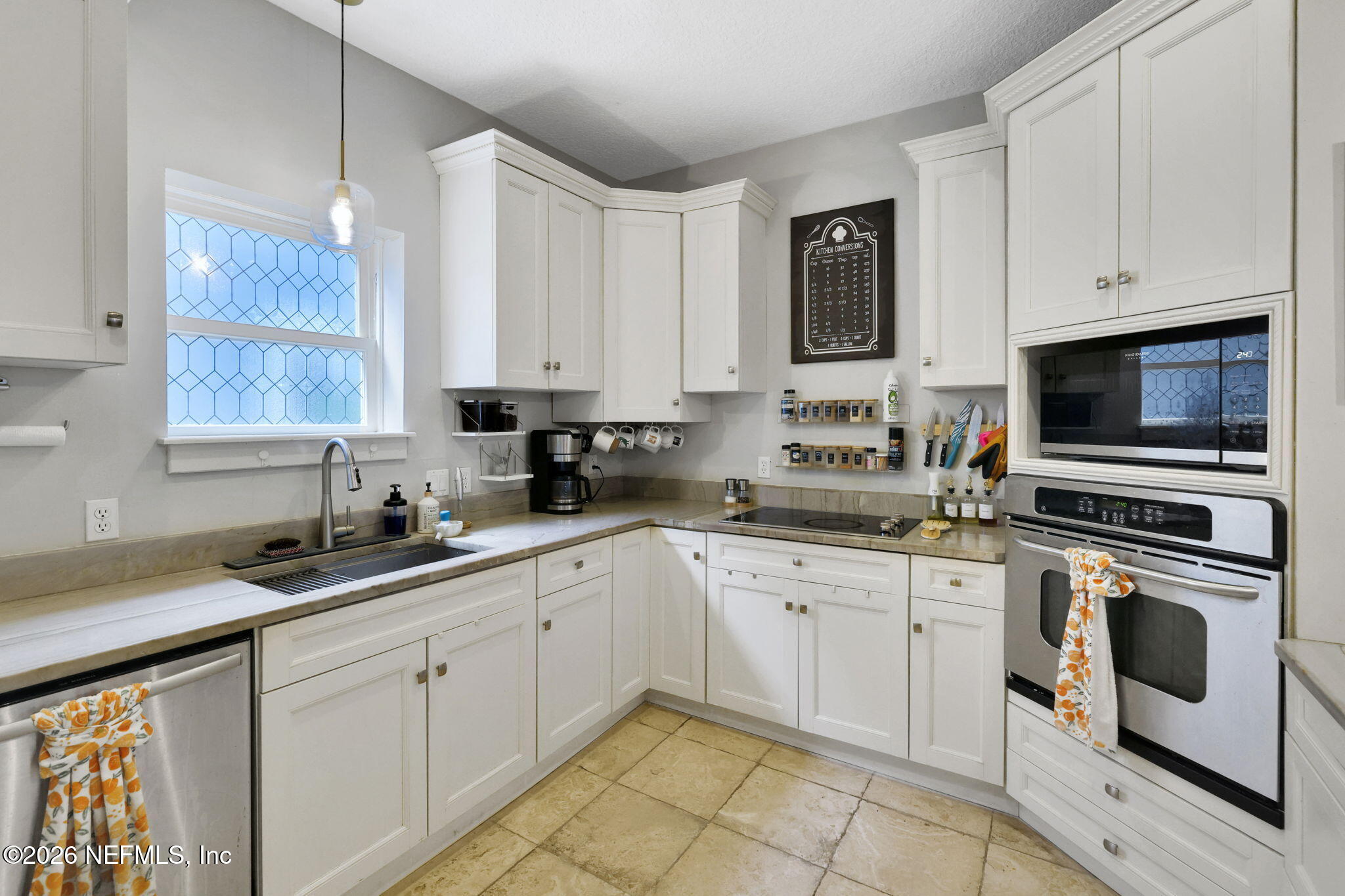 2837 Post Street Jacksonville, FL 32205 - Photo 22 of 70 a kitchen with white cabinets sink and stainless steel appliances