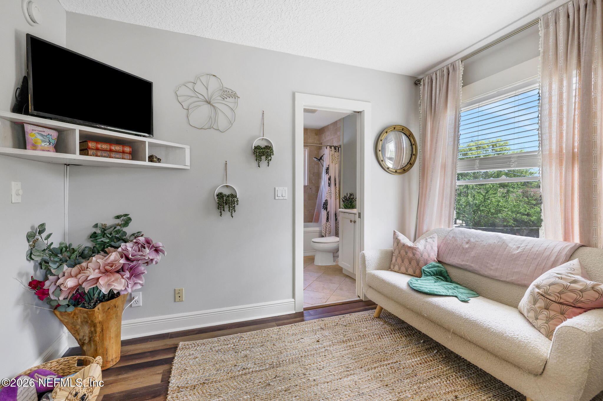 2837 Post Street Jacksonville, FL 32205 - Photo 32 of 70 a living room with furniture potted plant and a window