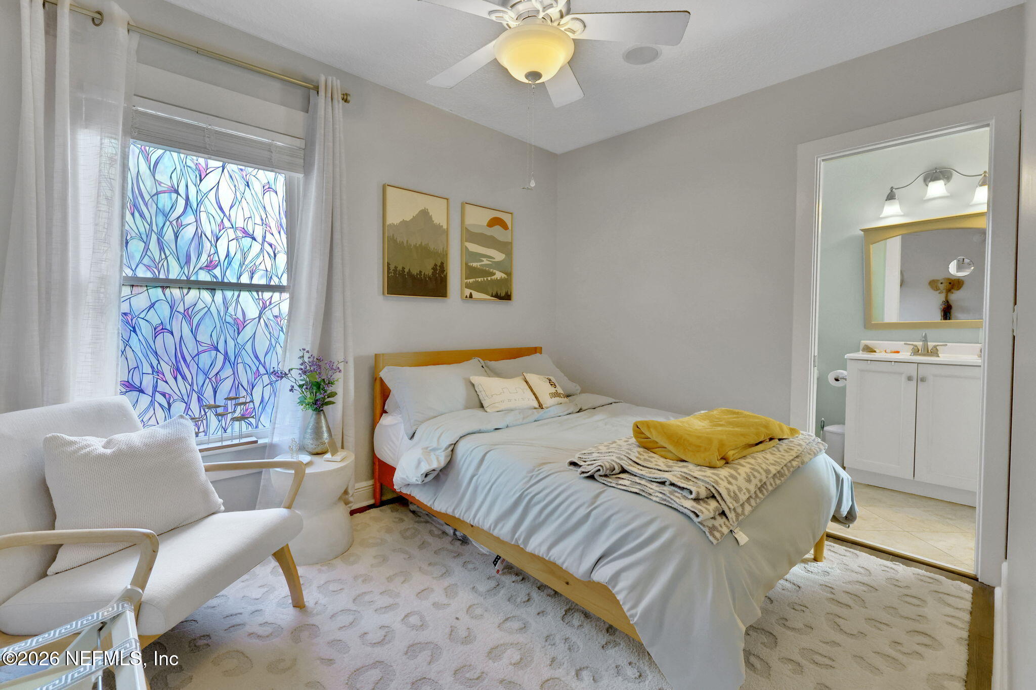 2837 Post Street Jacksonville, FL 32205 - Photo 36 of 70 a bedroom with a bed and a chandelier