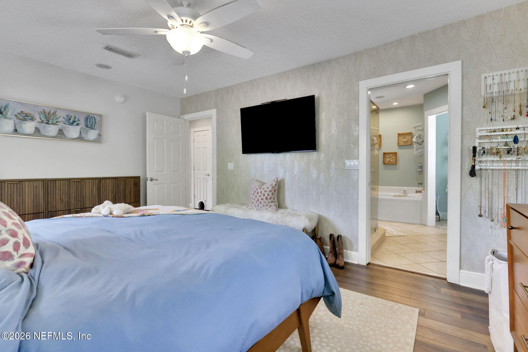 2837 Post Street Jacksonville, FL 32205 - Photo 39 of 70 a bedroom with a bed and a flat screen tv