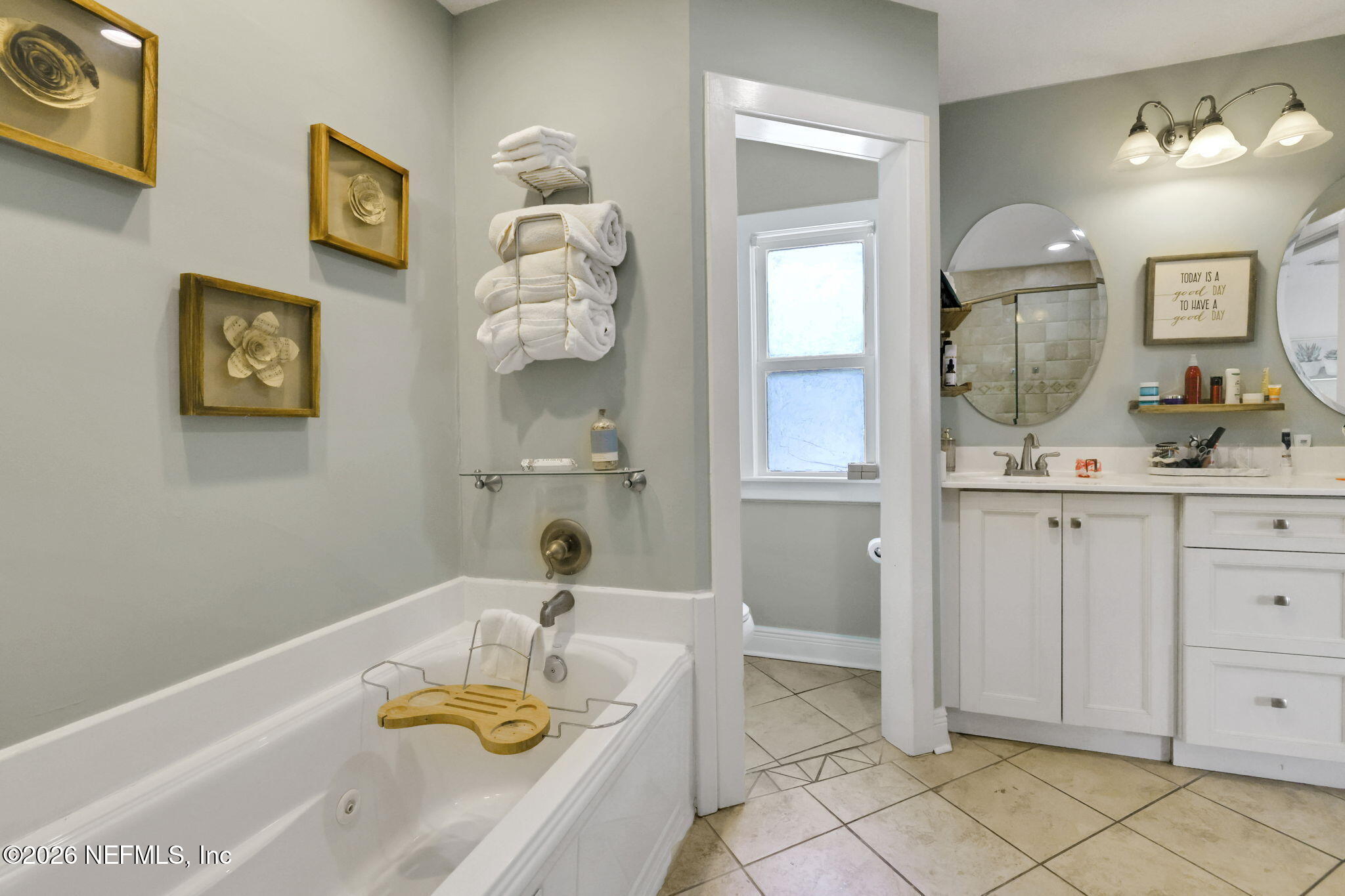 2837 Post Street Jacksonville, FL 32205 - Photo 44 of 70 a bathroom with a sink a vanity and a mirror