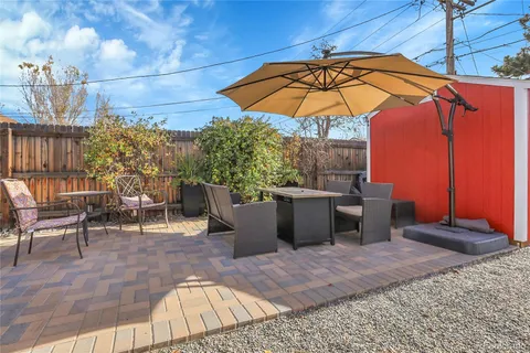 an outdoor space with furniture and umbrella