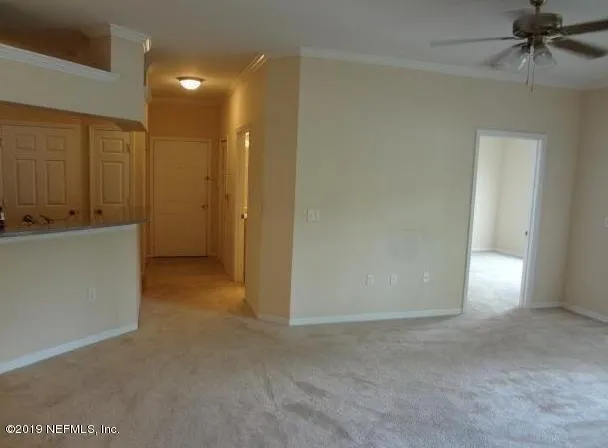 a view of a kitchen cabinets and a room