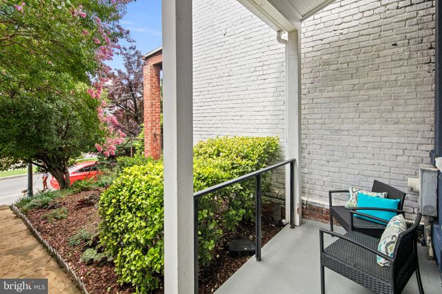 a living room with pool table and a window