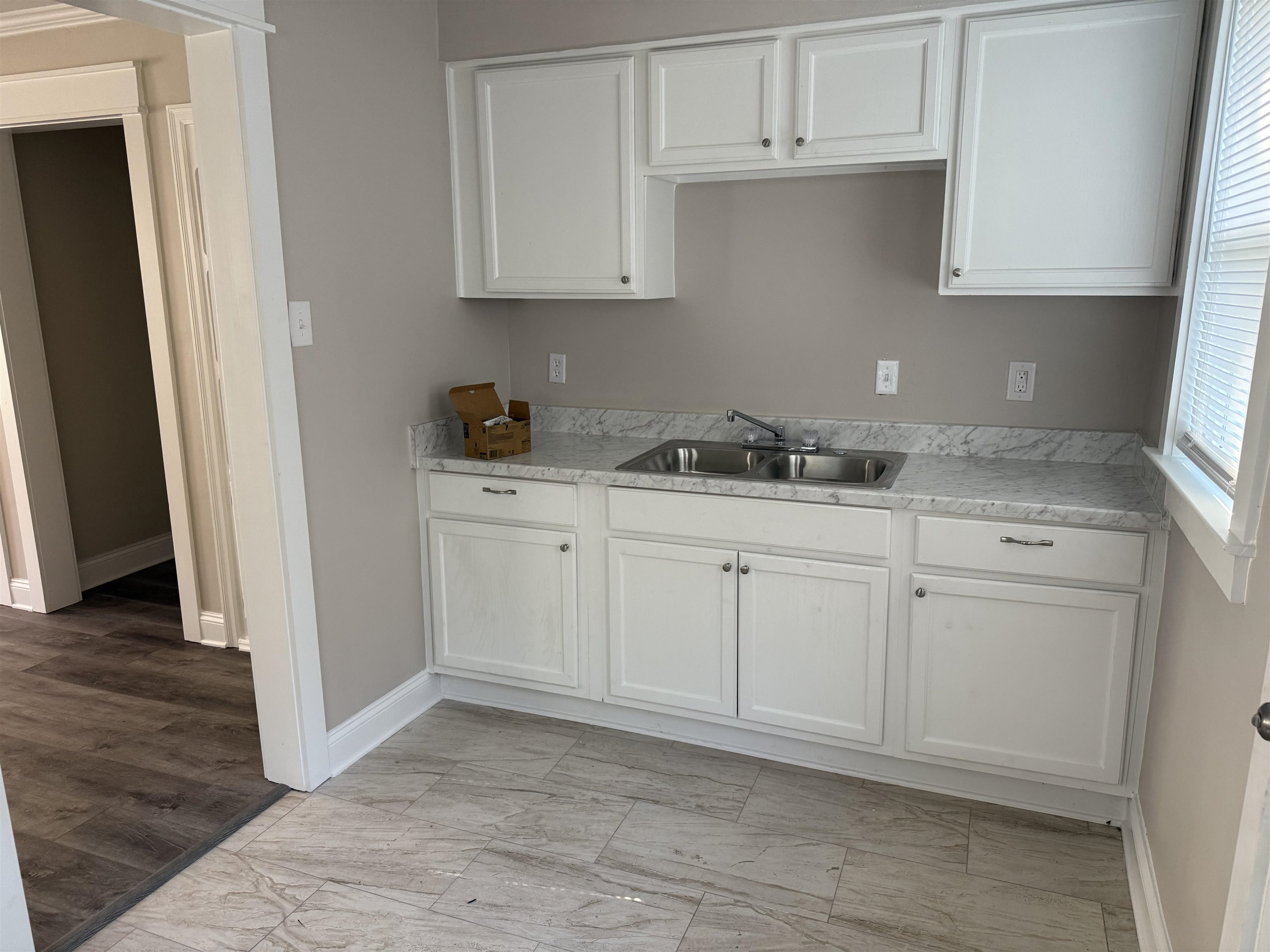 991 McEvers Road Memphis, TN 38111 - Photo 11 of 28 Kitchen featuring light countertops and white cabinetry