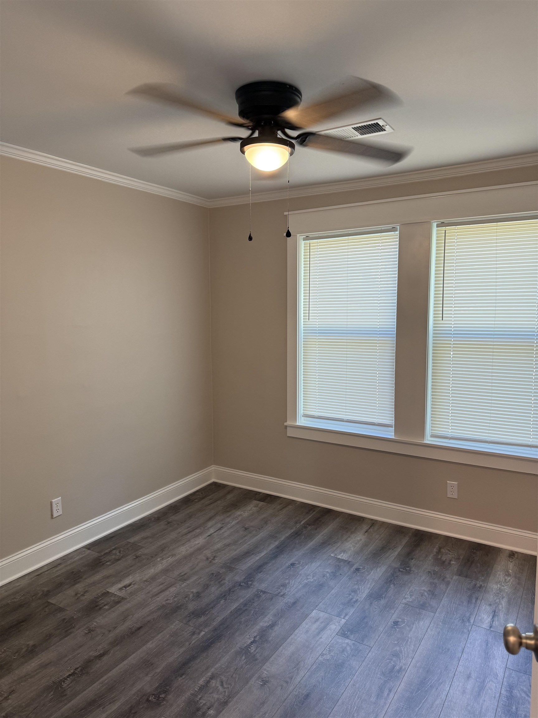 991 McEvers Road Memphis, TN 38111 - Photo 14 of 28 Empty room with crown molding, dark wood finished floors, and ceiling fan