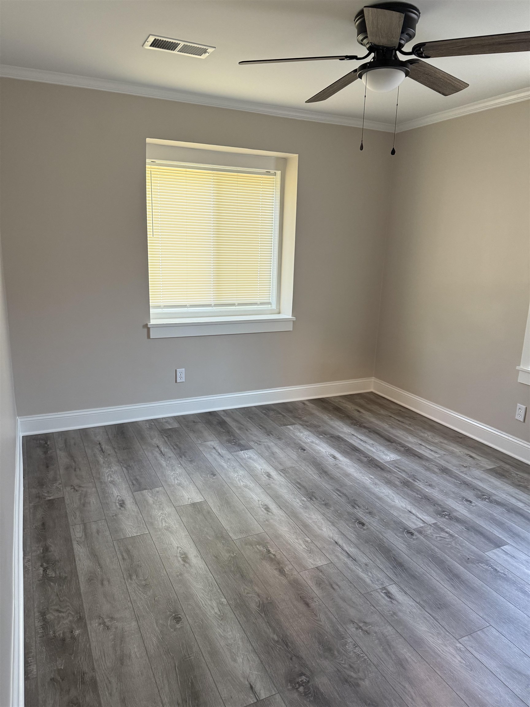 991 McEvers Road Memphis, TN 38111 - Photo 18 of 28 Empty room with ornamental molding and wood finished floors