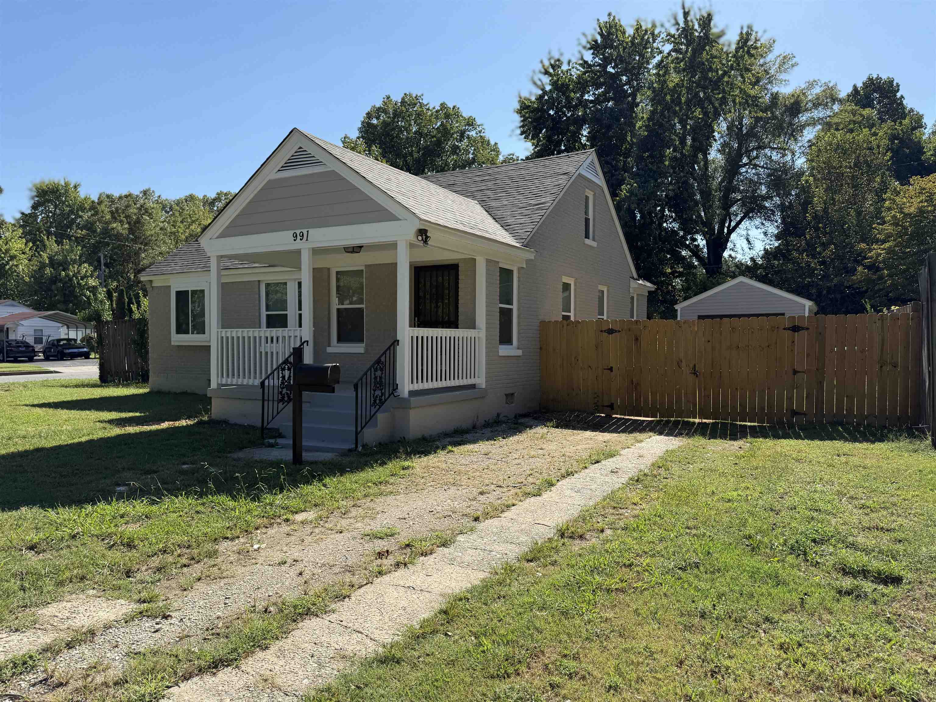 991 McEvers Road Memphis, TN 38111 - Photo 2 of 28 Bungalow featuring covered porch, a shingled roof, and brick siding