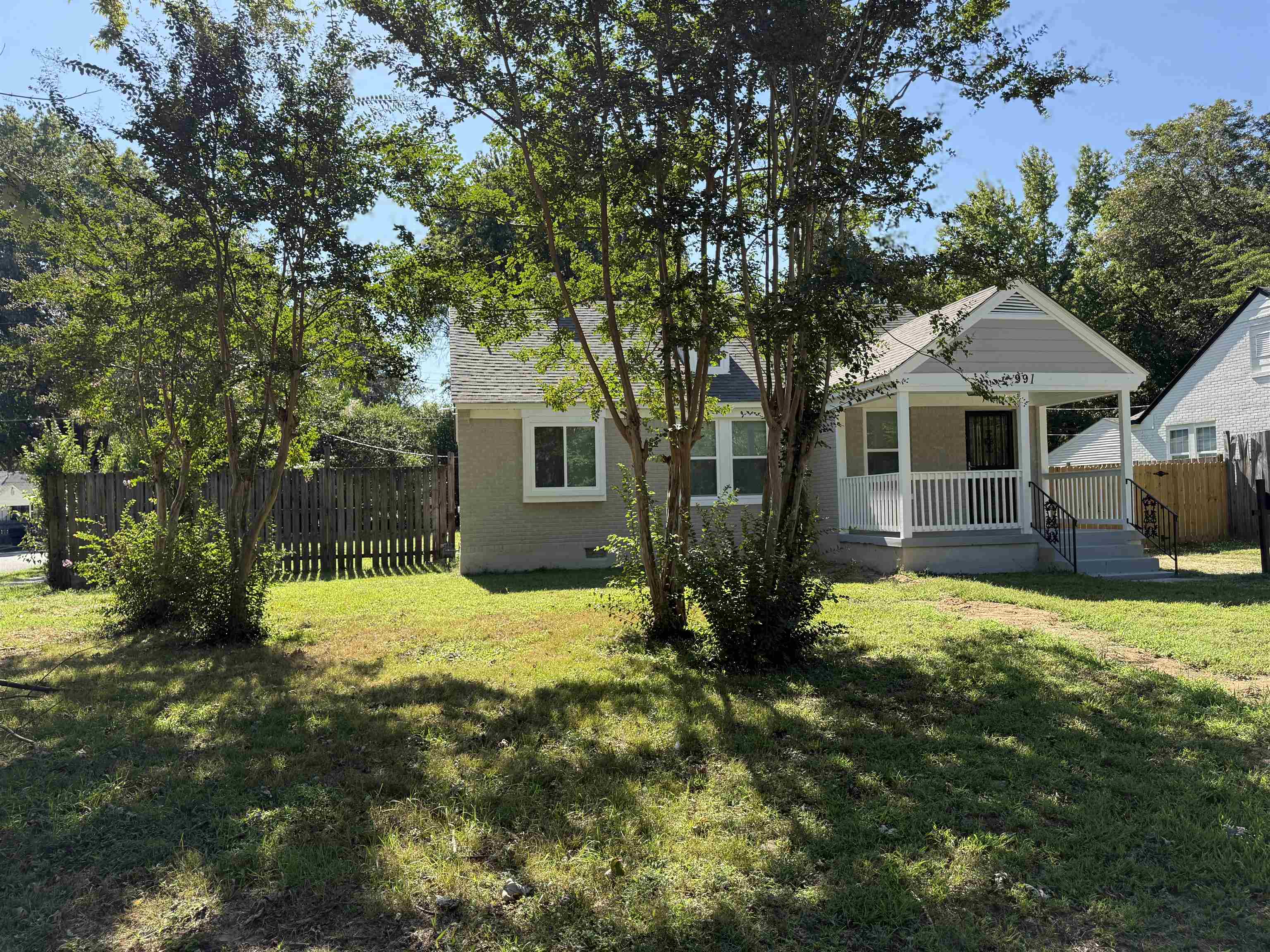 991 McEvers Road Memphis, TN 38111 - Photo 3 of 28 Rear view of house featuring a porch and brick siding