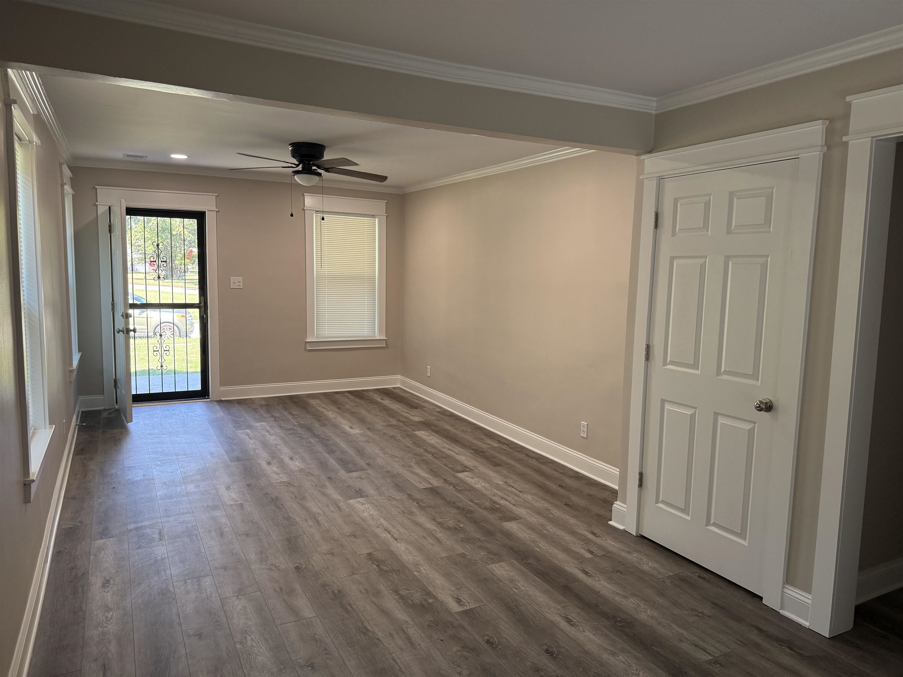 991 McEvers Road Memphis, TN 38111 - Photo 5 of 28 Spare room with ornamental molding, ceiling fan, and dark wood-style flooring
