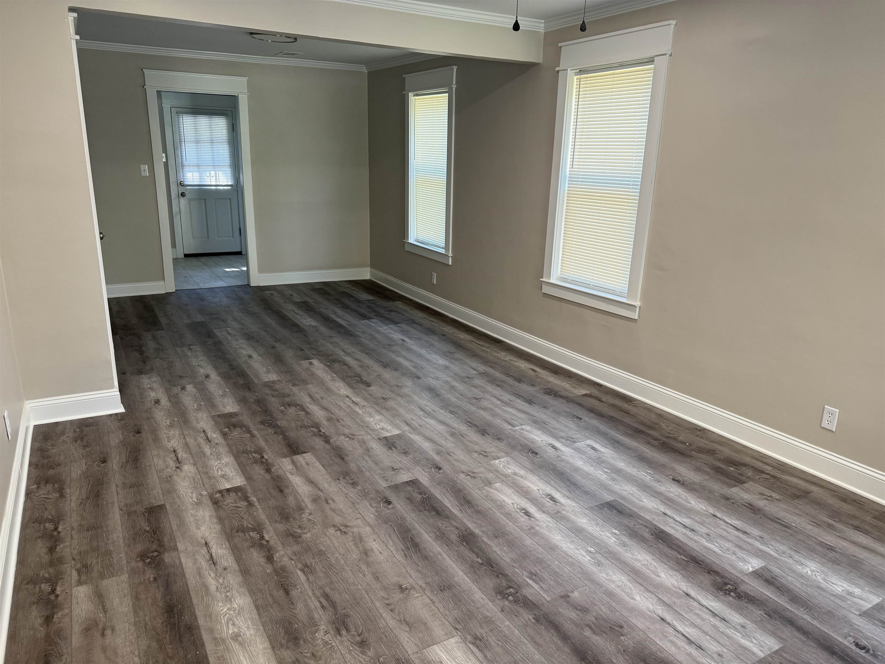 991 McEvers Road Memphis, TN 38111 - Photo 6 of 28 Empty room featuring ornamental molding and dark wood finished floors