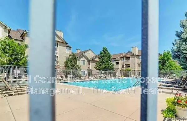 a view of a house with a yard and table and chair