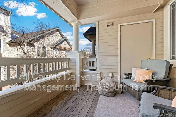 a bedroom with furniture and wooden floor