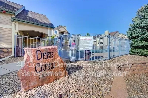 a view of a chairs and table in the patio