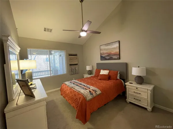 a bedroom with bed and window