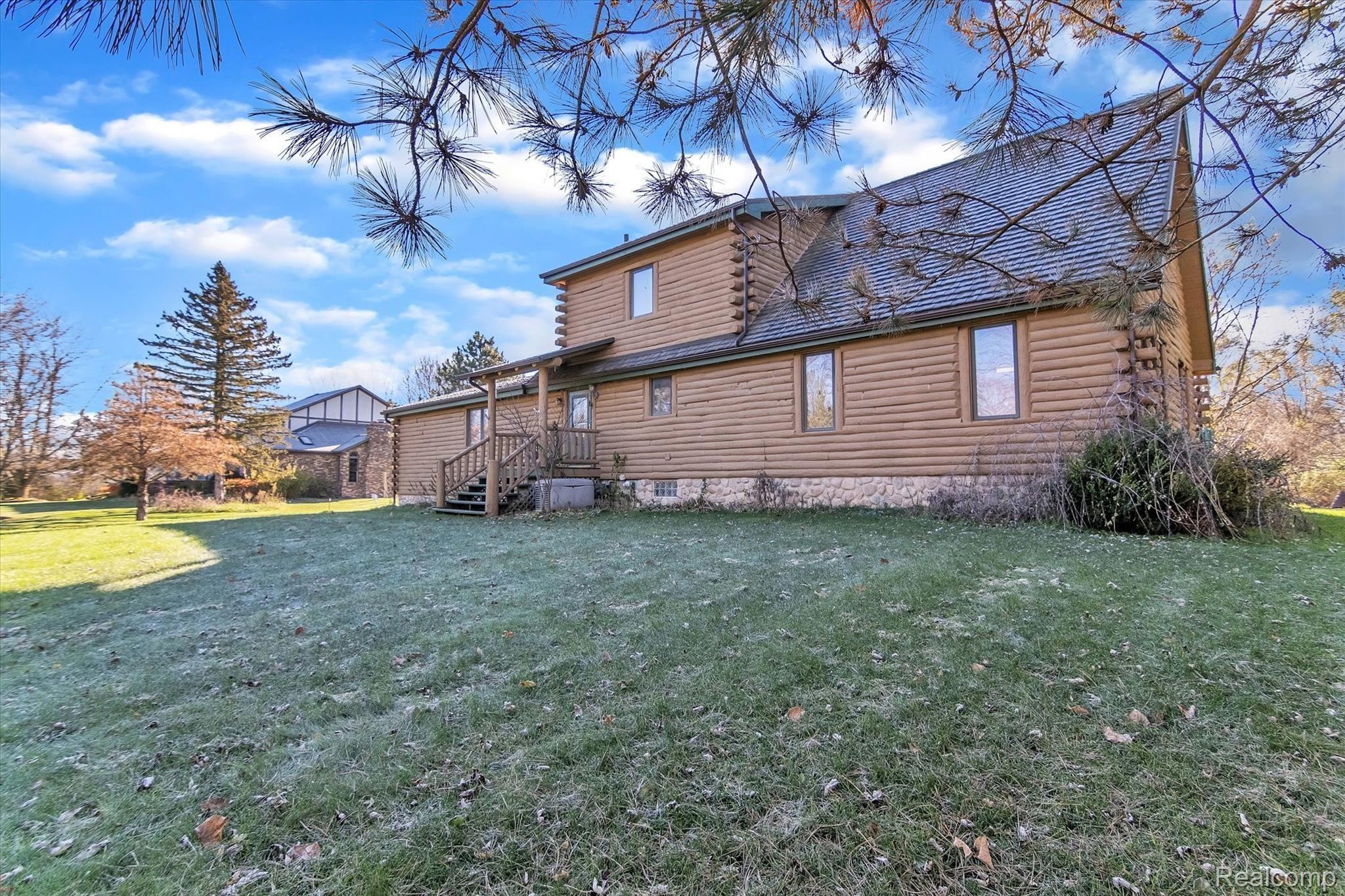 47111 Hull Road Belleville, MI 48111 - Photo 1 of 46 Custom built log home on 5 wooded acres!