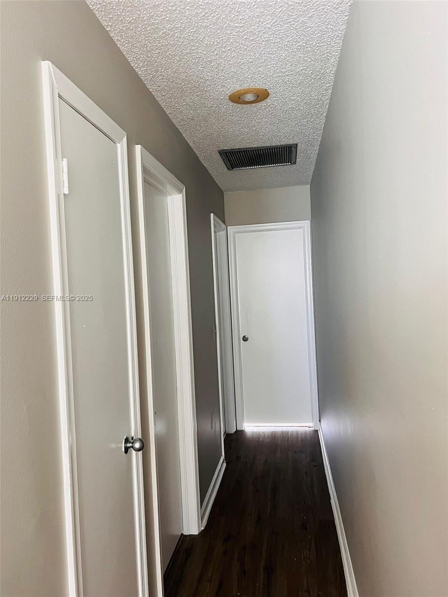 5130 Elmhurst Road, Unit H West Palm Beach, FL 33417 - Photo 11 of 15 a view of a hallway