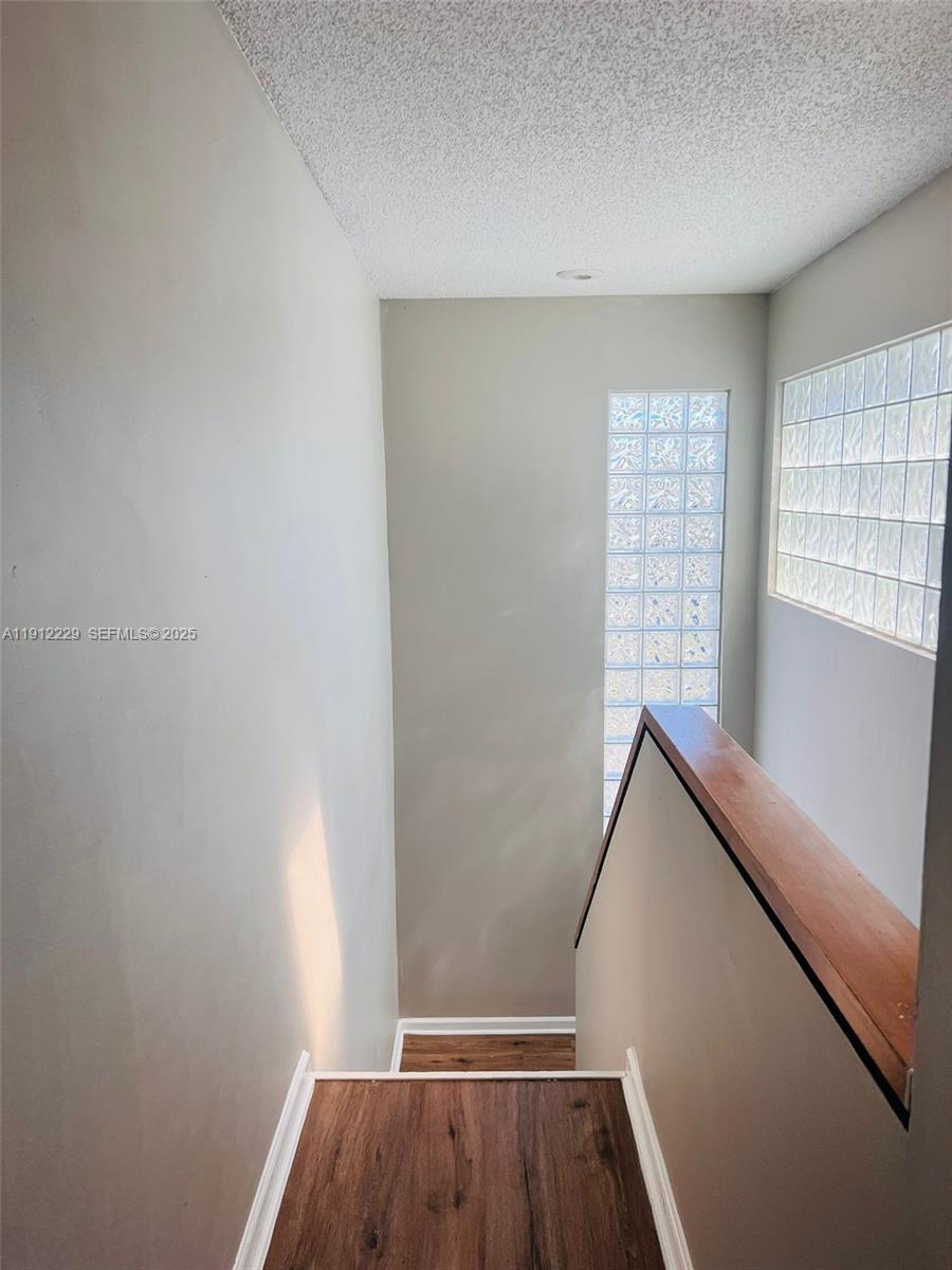 5130 Elmhurst Road, Unit H West Palm Beach, FL 33417 - Photo 9 of 15 a view of room with window and wooden floor