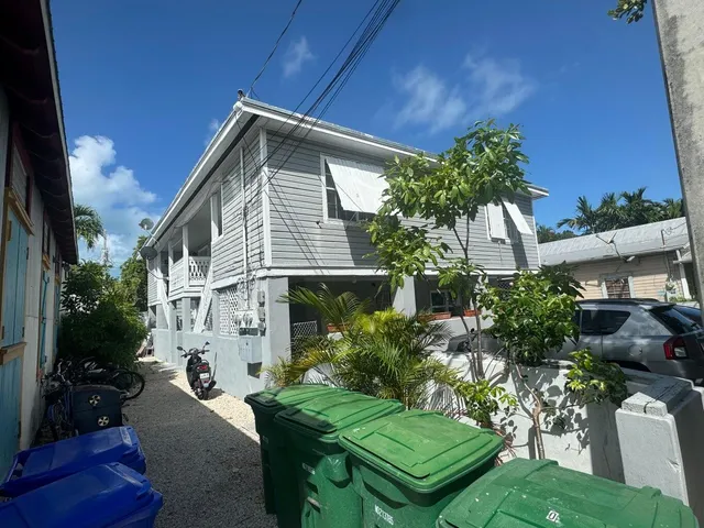 a view of backyard with plants and outdoor seating