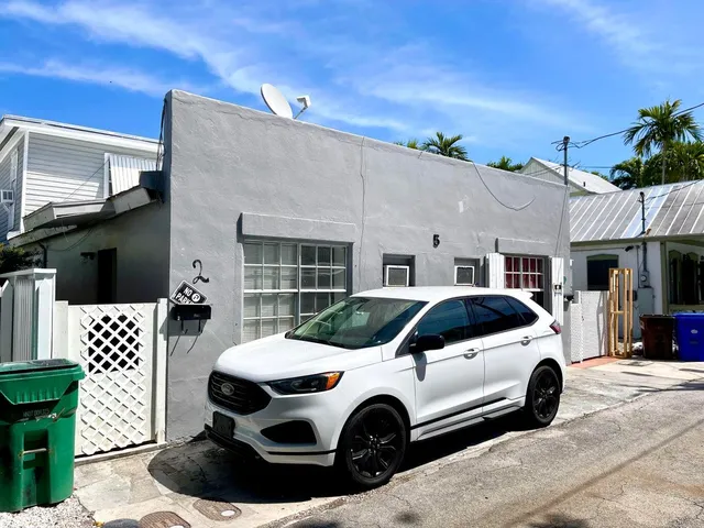 a view of a car parked in front of a building
