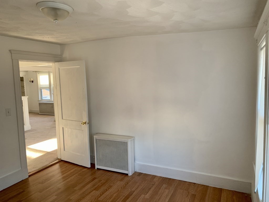 98 Faxon Road, Unit 1 Quincy, MA 02171 - Photo 3 of 3 a view of empty room with wooden floor