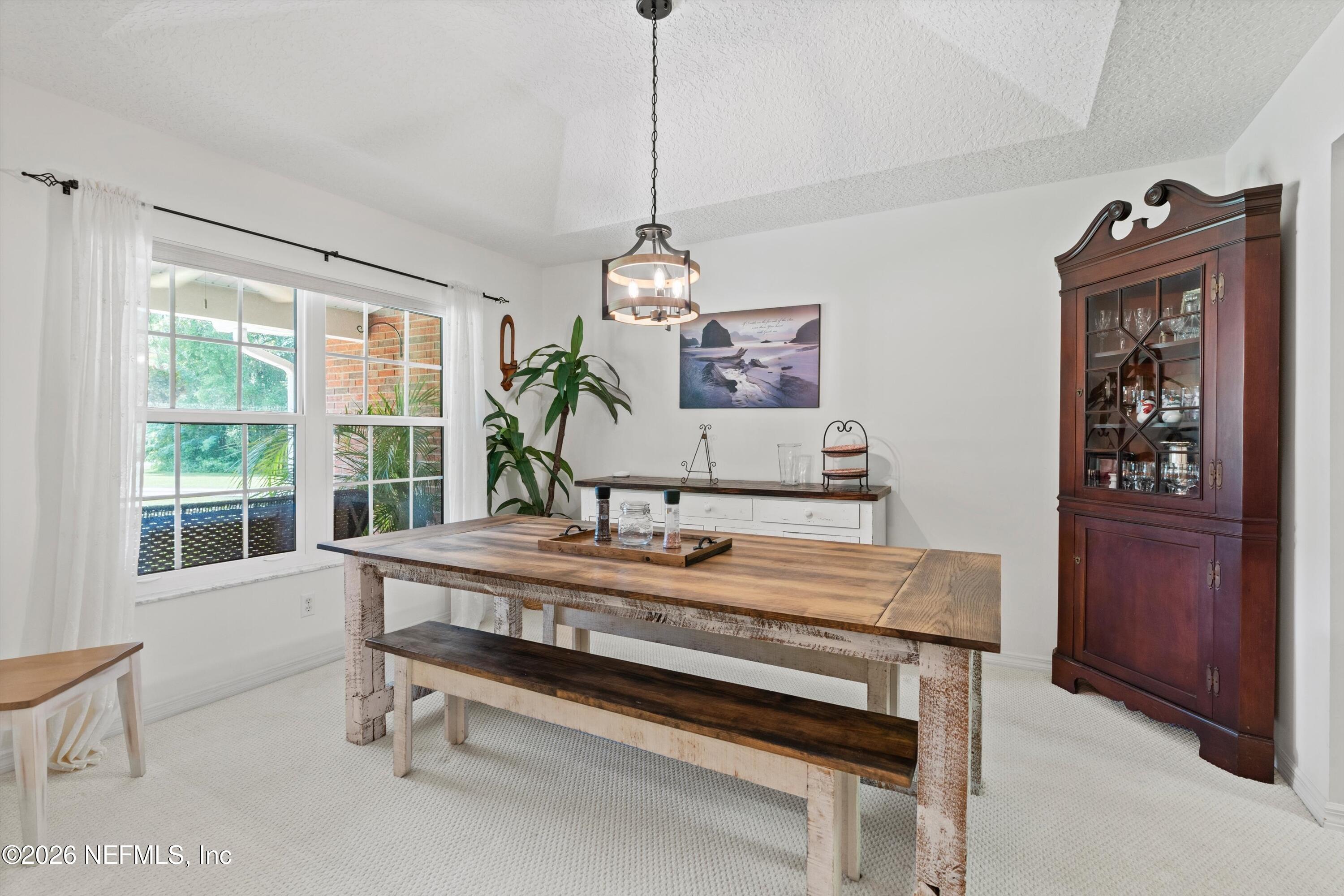5566 Don Manuel Road Elkton, FL 32033 - Photo 8 of 47 a dining room with a table and chairs