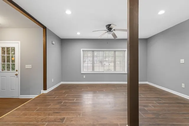 a view of an empty room with a window
