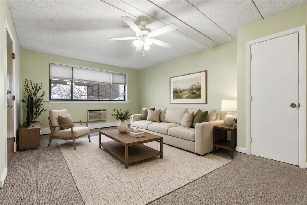 50 Water Street, Unit 46 Medford, MA 02155 - Photo 1 of 37 a living room with furniture and a large window