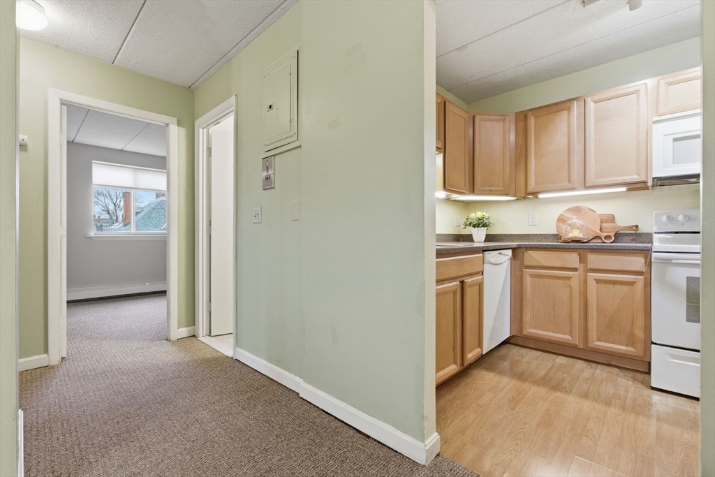 50 Water Street, Unit 46 Medford, MA 02155 - Photo 12 of 37 a view of a kitchen with sink cabinets and window
