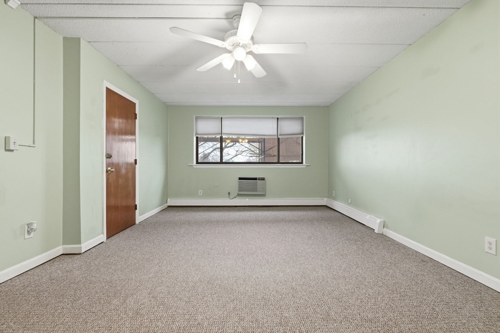 50 Water Street, Unit 46 Medford, MA 02155 - Photo 13 of 37 an empty room with a empty space and windows