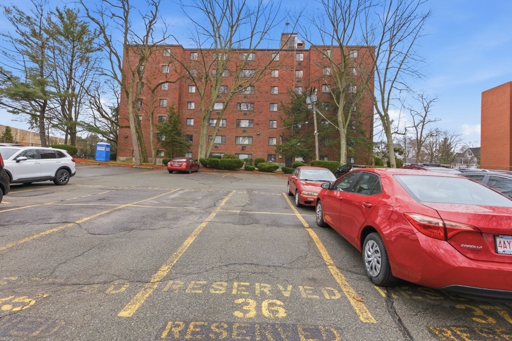 50 Water Street, Unit 46 Medford, MA 02155 - Photo 23 of 37 a view of a cars parked in front of a house