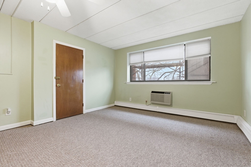 50 Water Street, Unit 46 Medford, MA 02155 - Photo 4 of 37 an empty room with windows