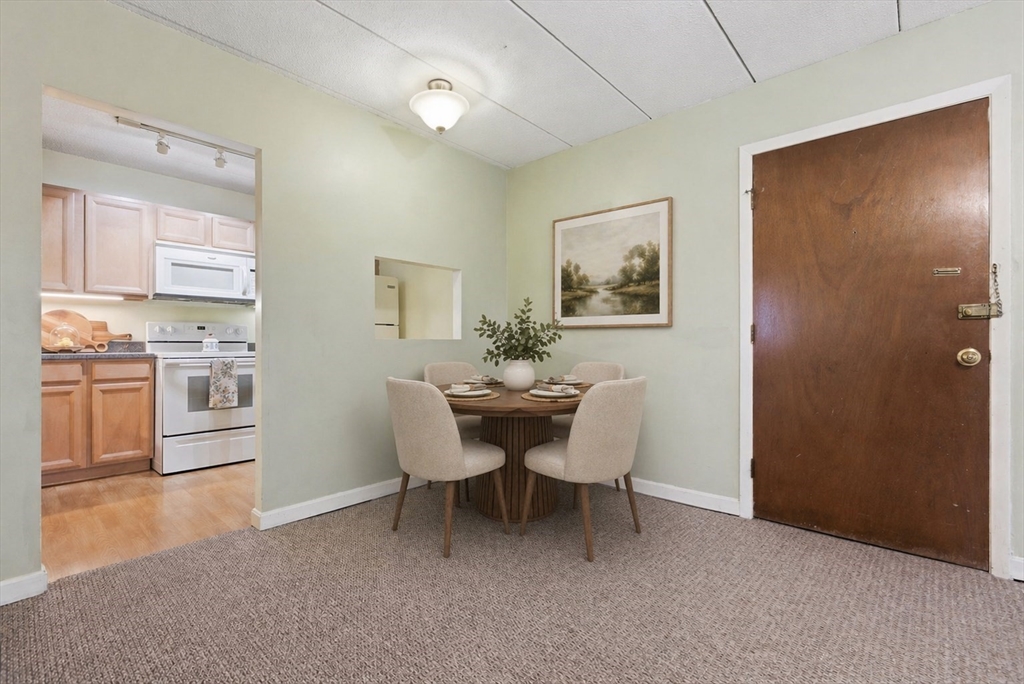 50 Water Street, Unit 46 Medford, MA 02155 - Photo 8 of 37 a view of a dining room with furniture and window