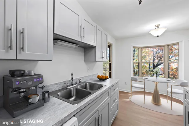 a kitchen that has a sink and a stove