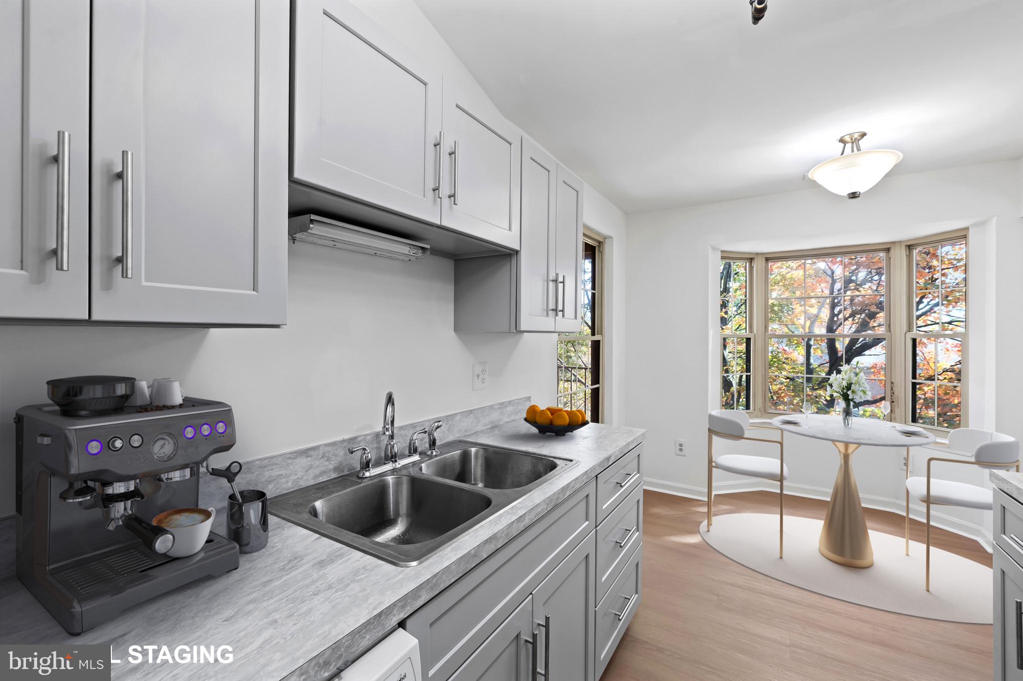 a kitchen that has a sink and a stove