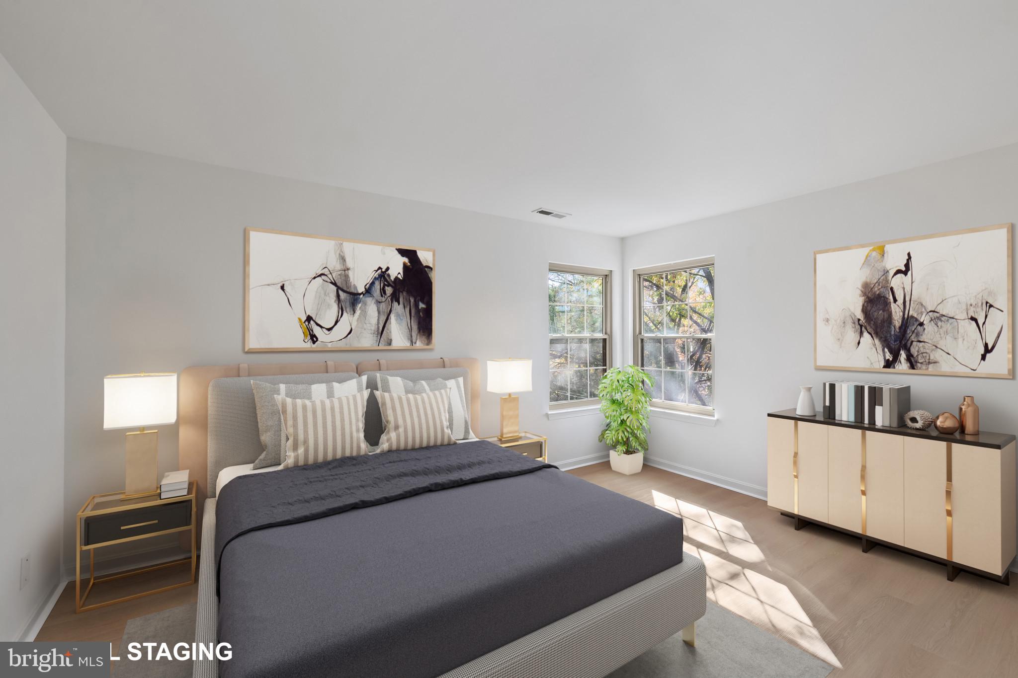 203 Star Pointe Court, Unit 3C Abingdon, MD 21009 - Photo 16 of 26 a bedroom with a bed and wooden floor