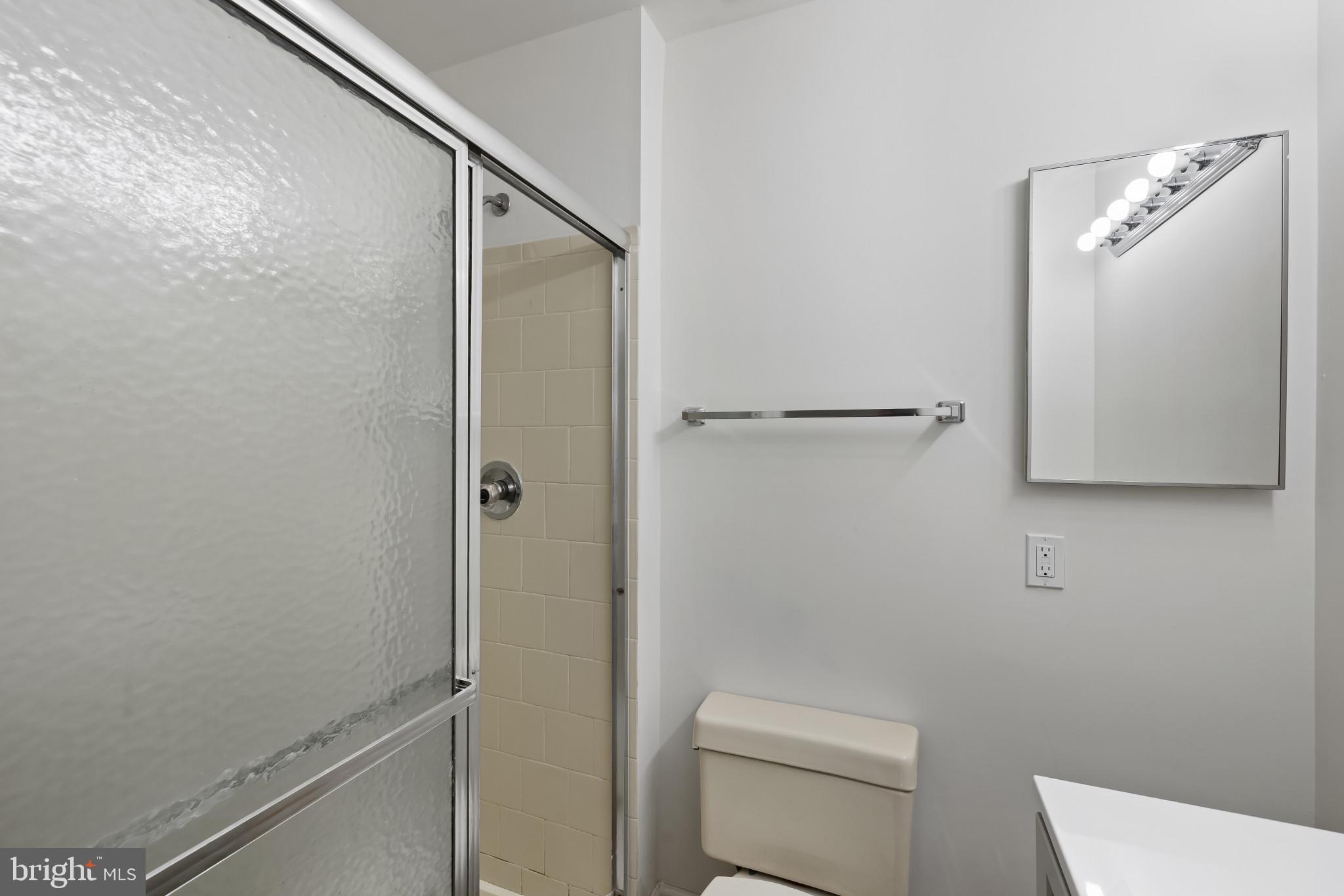 203 Star Pointe Court, Unit 3C Abingdon, MD 21009 - Photo 19 of 26 a bathroom with a shower a toilet and sink