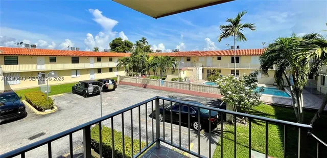 a view of a swimming pool with a patio