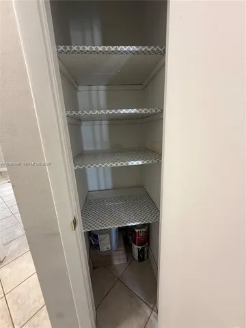 a view of a chairs and table in the balcony