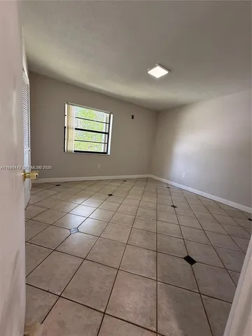 a bathroom with a double vanity sink mirror and shower
