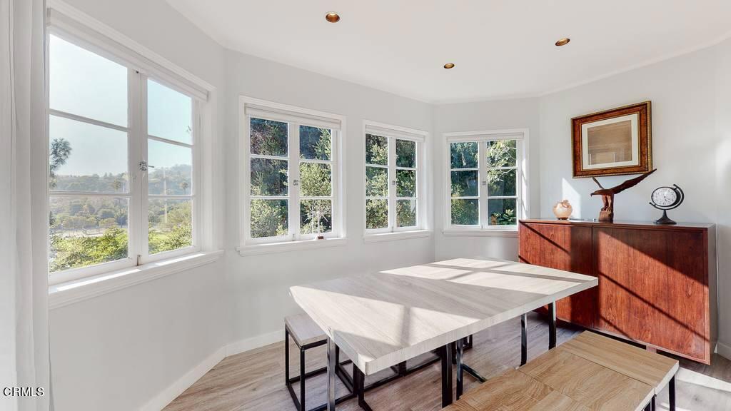 101 South Rockingham Avenue Los Angeles, CA 90049 - Photo 11 of 44 a view of a dining room with furniture window and outside view