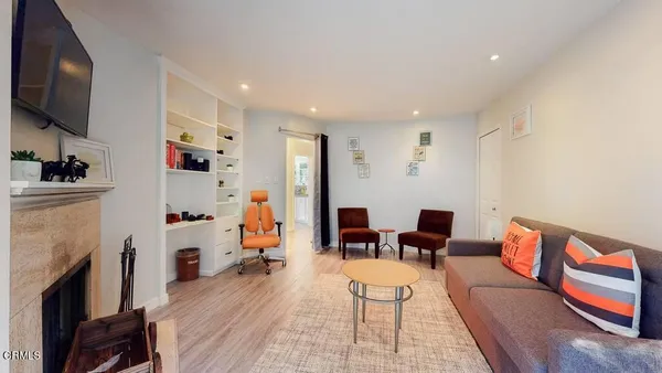 a view of living room and wooden floor