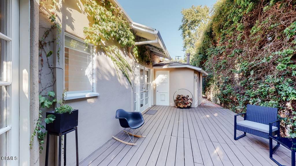 101 South Rockingham Avenue Los Angeles, CA 90049 - Photo 21 of 44 a view of a house with backyard and sitting area