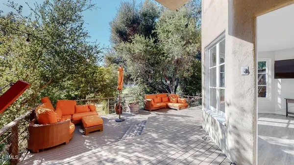 a view of a backyard with large trees